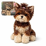 A fluffy little dog with a tiny ponytail sits perched on a leather couch, looking curiously at the camera with a cozy home background featuring wooden furniture, a plant, and a patterned rug.