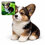 A fluffy tricolor corgi puppy sits attentively on vibrant green grass, ears perked up and eyes full of curiosity, basking in the sunlight with a white picket fence softly blurred in the background.