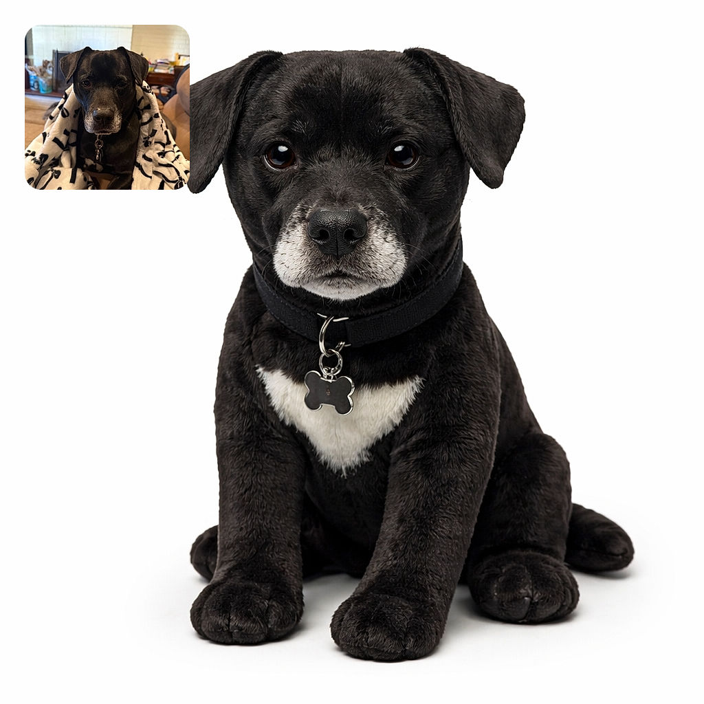 A cozy black dog wrapped in a white blanket with black paw and bone prints, sitting comfortably on a couch with a homey background featuring a fireplace and shelves. The dog looks calm and slightly curious, as if enjoying a lazy day indoors.