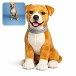 A happy dog with a tan and white coat sits obediently on a smooth blue backdrop, tongue out and ears perked, looking ready for a treat or a belly rub.