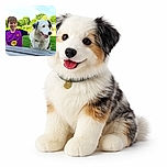 A cheerful boy in a bright purple sports jersey sits outdoors next to a fluffy white and black dog, both looking off to the side with happy expressions on a sunny day with lush green trees in the background.