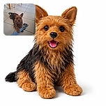 A happy, scruffy dog with big ears is lying on a tiled floor, gripping a blue and white rope toy with its paws, looking excited and ready to play. The background shows wooden chair legs and a doorway, giving a cozy indoor vibe.