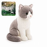 Two cats are having a quiet garden summit on the stone wall, while a tiny black grill and a white stool stand nearby like the official furniture for their outdoor board meeting. The scene is viewed through a window, complete with a blurry flower cameo in the foreground.