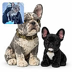 Two Frenchie adventurers lounge like tiny kings in a black wagon — one regal merle staring off like he's plotting the neighborhood, the smaller black pup is wide-eyed and suspicious of blue tissue treasures. Sidewalk runway, dramatic ears, maximum cute.