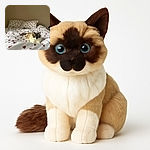 A fluffy cat with striking blue eyes lounges regally on a bed adorned with white sheets covered in red hearts, blending love and laziness in perfect harmony against a plain beige wall.