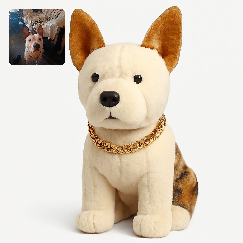 A curious dog with large ears and a chain collar looks up eagerly in a dimly lit room with wooden floors and a couch covered in a floral blanket. The atmosphere feels cozy but a bit cluttered with a shoe and some furniture visible.