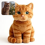 A majestic ginger cat sits elegantly on a wooden surface with a softly blurred, twinkling Christmas tree in the background, radiating cozy holiday vibes and feline charm.