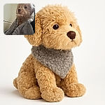 A fluffy dog wrapped snugly in a cozy gray blanket, looking off into the distance with a calm and thoughtful expression, sitting on a studded armchair against a plain wall.