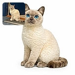 A fluffy cream-colored cat with striking blue eyes sits attentively on a doormat in front of a blue door, looking up with curiosity as if waiting for an adventure to begin.