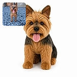 A cheerful scruffy little dog stands proudly on a bed of blue gravel, tongue out and ears up like a tiny rock-garden tour guide. Behind it, brickwork and flower boxes add a cozy garden backdrop.