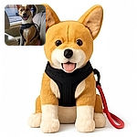 A happy dog wearing a black harness sits comfortably in the back seat of a car, tongue out and ears perked up, ready for an adventure or a car ride full of tail wags and window sniffs.