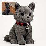 A curious gray kitten with a red collar sits attentively on a gray mat against a wooden floor and beige wall backdrop, looking up with wide eyes as if expecting a treat or an adventure.