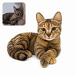 A very serious-looking tabby cat lounges on a plush cat-tree platform, staring into the camera like it has just been promoted to manager of the household. One paw stretches dramatically forward while the scratching post stands guard beside it.