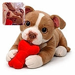 A dog lies cozily on a bed with white sheets, clutching a bright red bone-shaped toy. The photo is decorated with small red heart graphics floating around, adding a cute and affectionate vibe to the scene.