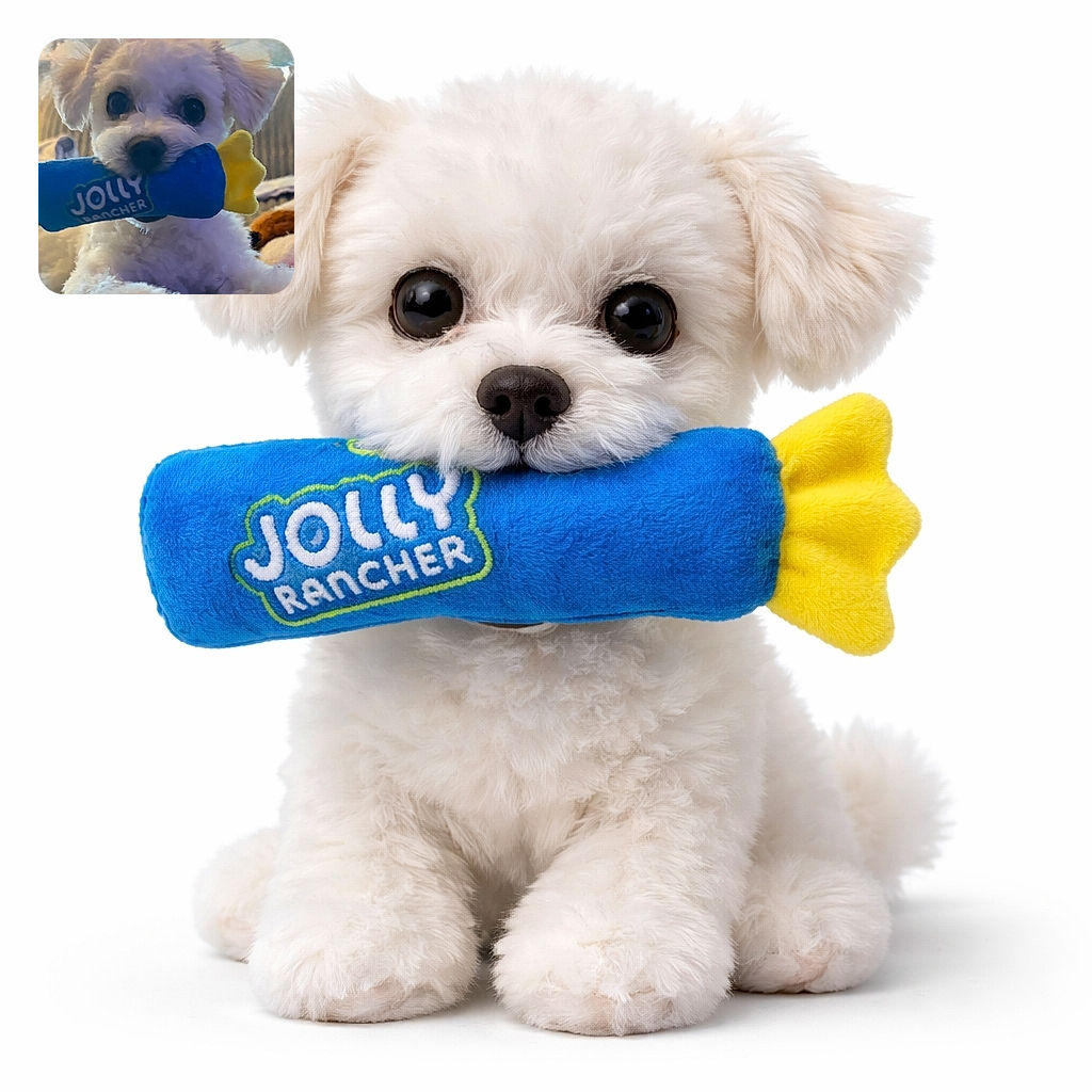 A fluffy white puppy holding a blue and yellow toy in its mouth, looking adorably at the camera with big dark eyes, lying on a cozy surface with a soft background.