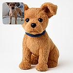 A curious small brown dog stands confidently on a white table, ears perked and eyes wide open, with a blurred background hinting at a gym or workout space.
