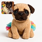 A close-up photo of a pug wearing a colorful tutu, looking straight into the camera with big, expressive eyes. The wooden floor background adds a warm touch, and the dog's serious expression contrasts humorously with the playful outfit.