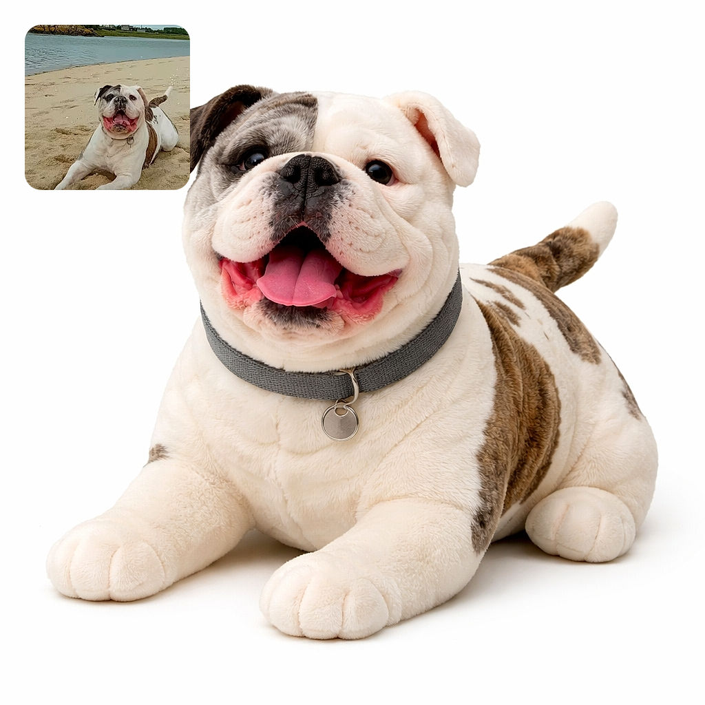 A joyful bulldog is sprawled out on a sandy beach, proudly sporting a sandy nose and a big, happy grin. The calm water and rocky shore in the background add a peaceful vibe to this playful scene.