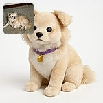 A fluffy cream-colored dog lounges on a speckled tile floor, looking off to the side with a calm and curious expression, its fur ruffled slightly and a collar with a tag visible.