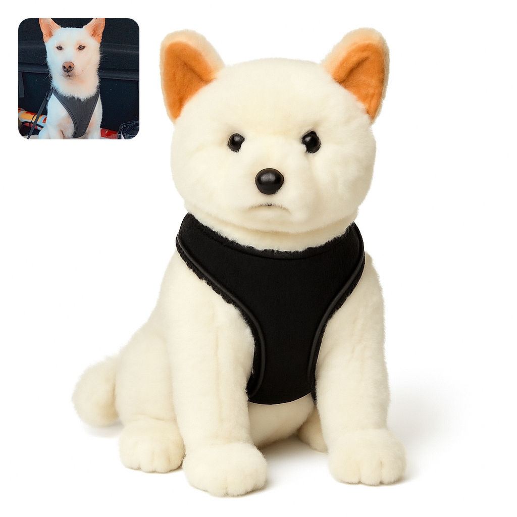 A poised white dog with a black harness sits patiently in the back of a car, ears perked up and eyes full of calm curiosity. The background is a mix of car interior and a colorful object, with three small black heart emojis floating near the dog's head adding a touch of affection.