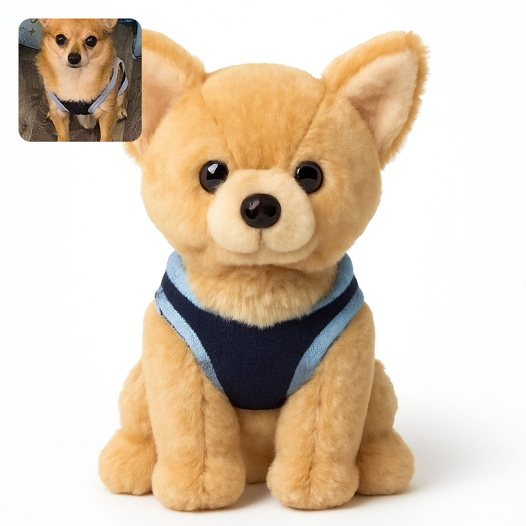 A small tan dog wearing a harness sits attentively on a wooden floor in front of a cozy blue pet tent, looking straight at the camera with big, curious eyes.