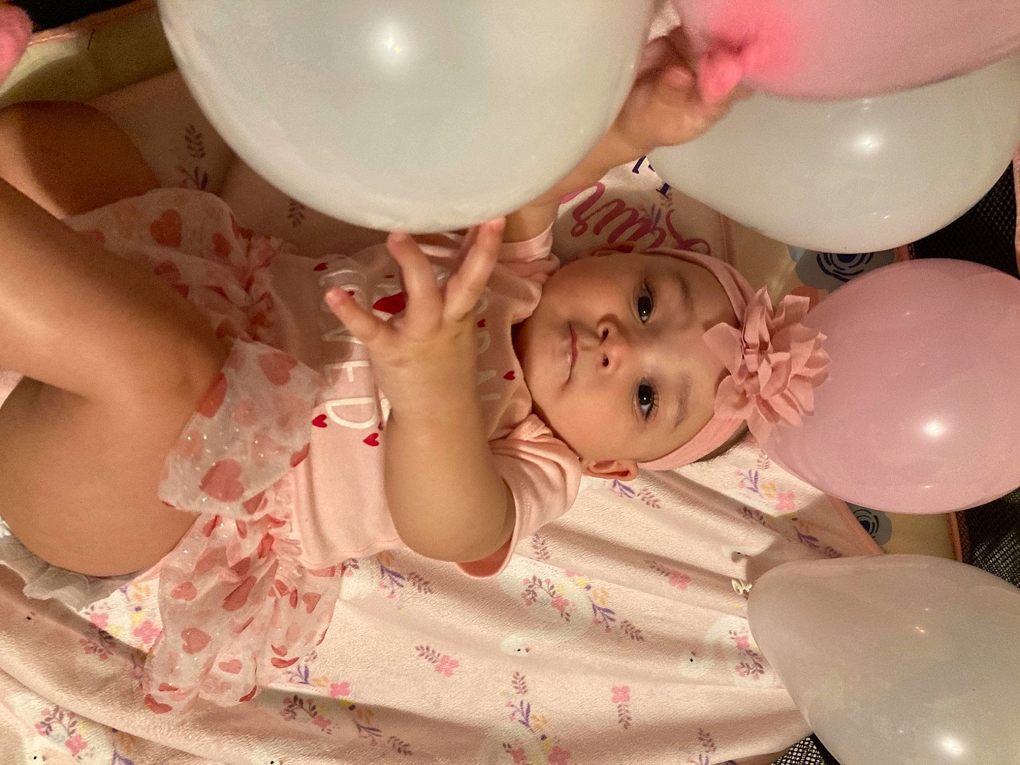 Laurel is registered to the contest to win money with this photo: baby, baby_toddler_clothing, balloon, beauty, cheek, child, ear, event, fun, happy, head, headwear, organ, party, party_supply, person, pink, plastic, skin, smile