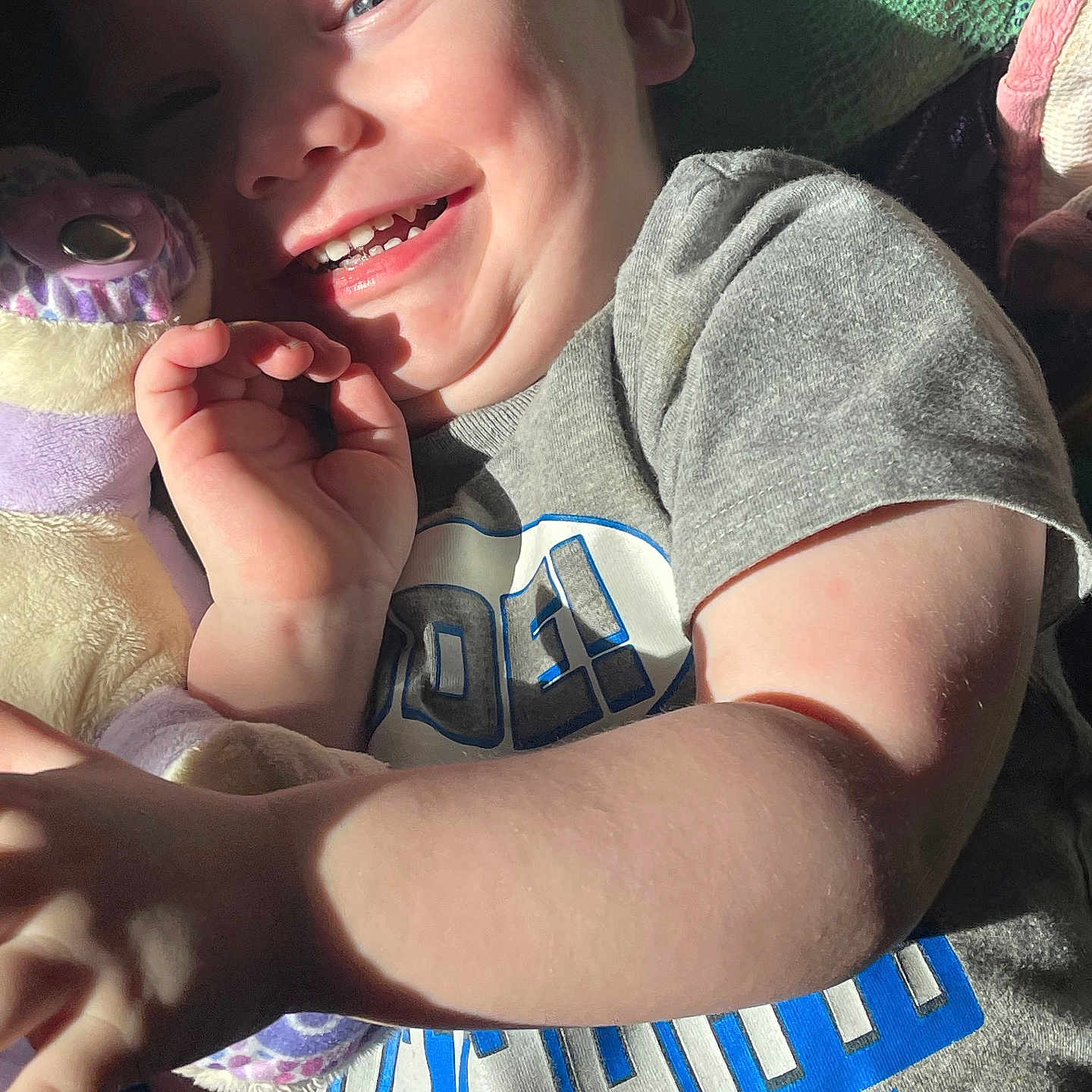Xavier is registered to the contest to win money with this photo: accessories, baby, bodypart, bracelet, clothing, face, finger, hand, happy, head, homedecor, jewelry, laughing, mouth, person, photography, portrait, smile, t_shirt, teeth