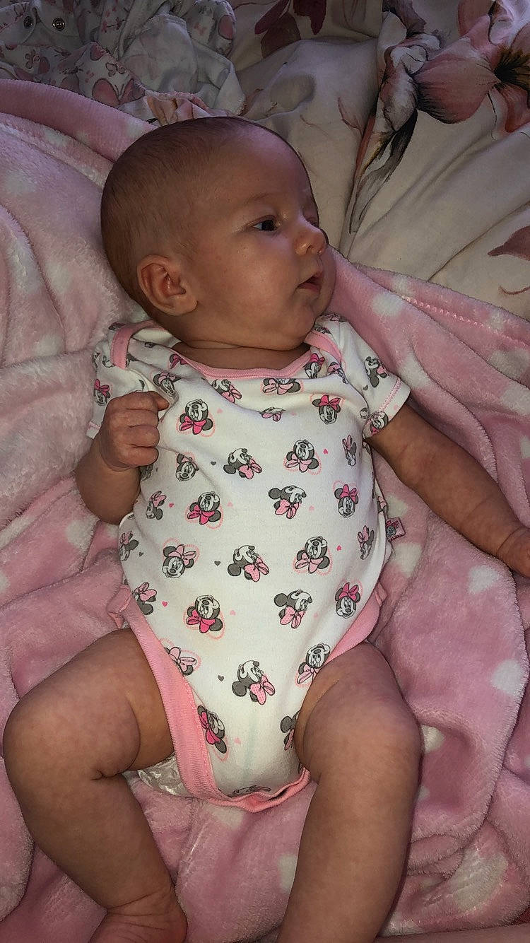 Esmay is registered to the contest to win money with this photo: baby, baby_toddler_clothing, cheek, child, person, pink, skin, toddler