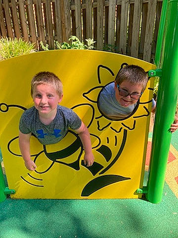 Jackson Papili joined the competition — help win amazing prizes! child, chute, fun, grass, happy, joy, leisure, outdoor_play_equipment, person, play, playground, recreation, room, shorts, sitting, smile, swing, t_shirt, toddler, vacation