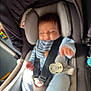 Riley is registered to the contest to win money with this photo: baby, car_seat, infant, blue_clothing, pacifier, safety_belt, cushion, sleeping, hand, toy, indoor, child, seat, comfort, cute, small_person, infant_clothing, head_support, baby_accessory, soft