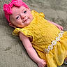 Willow joined the competition — help win amazing prizes! baby, child, infant, yellow_dress, pink_headband, bow, lace, floral, smile, blue_eyes, blanket, soft_texture, cute, portrait, lying_down, happy, young, person, indoors, skin