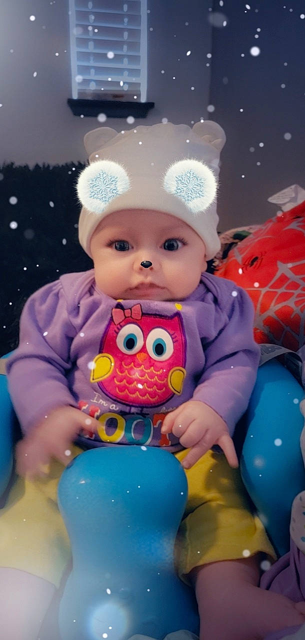 Aayla is registered to the contest to win money with this photo: baby, baby_playing_with_toys, baby_products, baby_toddler_clothing, baby_toys, blue, cheek, child, fun, happy, headwear, light, party_supply, person, pink, play, product, sitting, skin, toddler