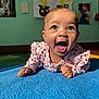 Brielle joined the competition — help win amazing prizes! baby, child, infant, smiling, happy, blue_carpet, pink_clothing, heart_pattern, indoor, playroom, wall_art, colorful, cute, portrait, toddler, hands, face, eyes, mouth_open, joyful
