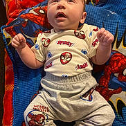 Javonte joined the competition — help win amazing prizes! baby, infant, spiderman, blanket, clothing, blue, red, pattern, cute, child, portrait, lying_down, indoors, happy, fist, toddler, costume, superhero, fabric, soft