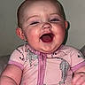 Blakely joined the competition — help win amazing prizes! baby, child, laughing, pink_onesie, blanket, indoor, portrait, happy, smiling, infant, cute, face, human, sitting, clothing, young_child, skin, head, expression, background