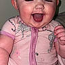 Blakely is registered to the contest to win money with this photo: baby, child, infant, smiling, laughing, onesie, pink_clothing, blanket, happy, cute, face, person, indoor, portrait, skin, head, hand, cheerful, toddler, young