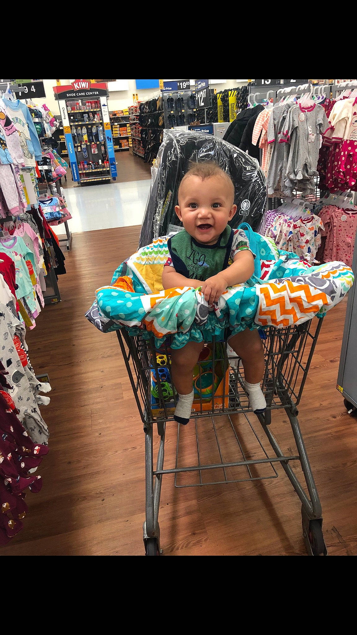 Andrew is registered to the contest to win money with this photo: chair, child, person, shopping, sitting, smile, textile, toddler, vehicle