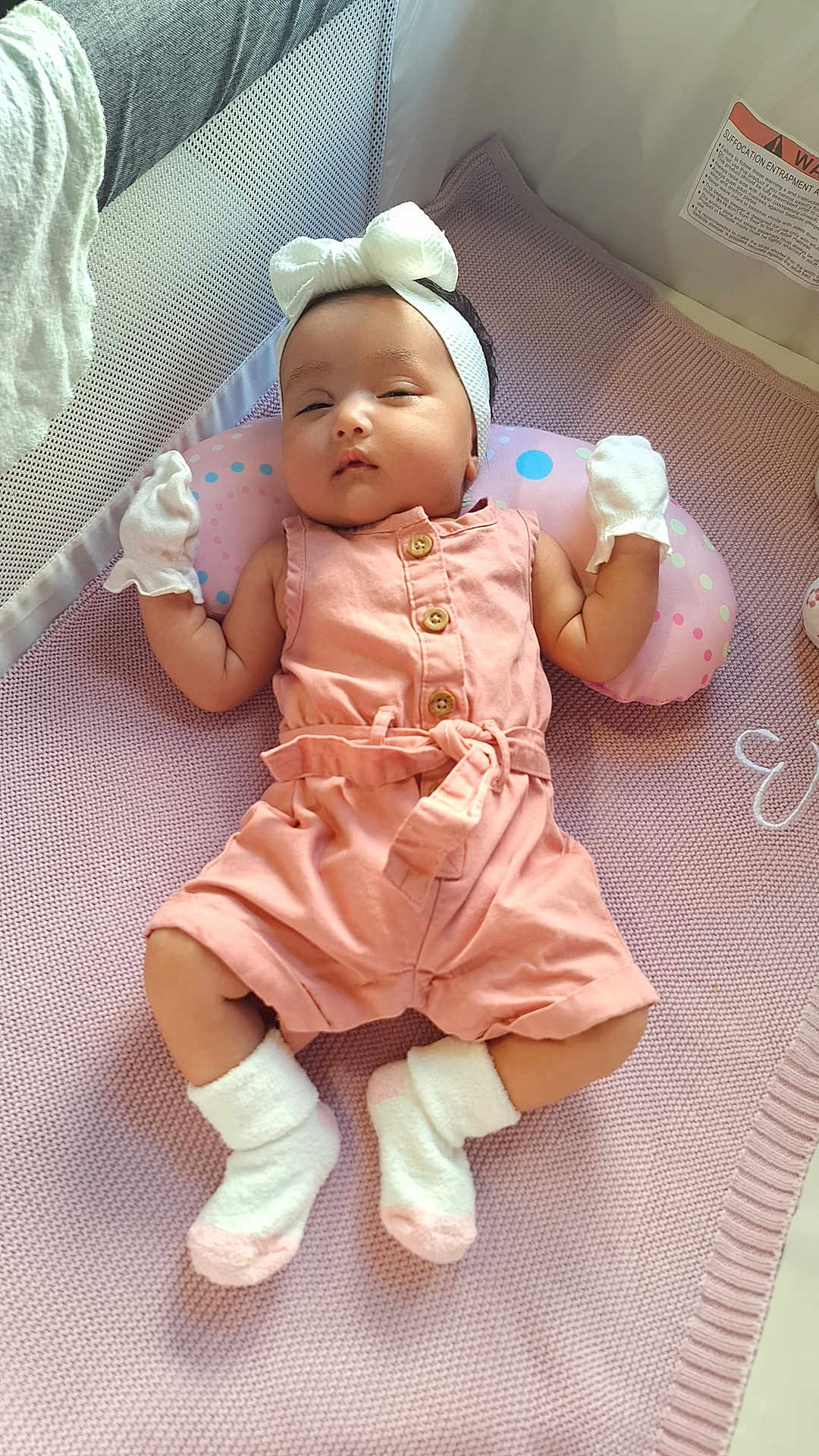 Emma joined the competition — help win amazing prizes! baby, infant, sleeping, pink, romper, mittens, headband, bow, blanket, sock, cozy, cute, child, indoor, soft, resting, newborn, person, laying, nursery