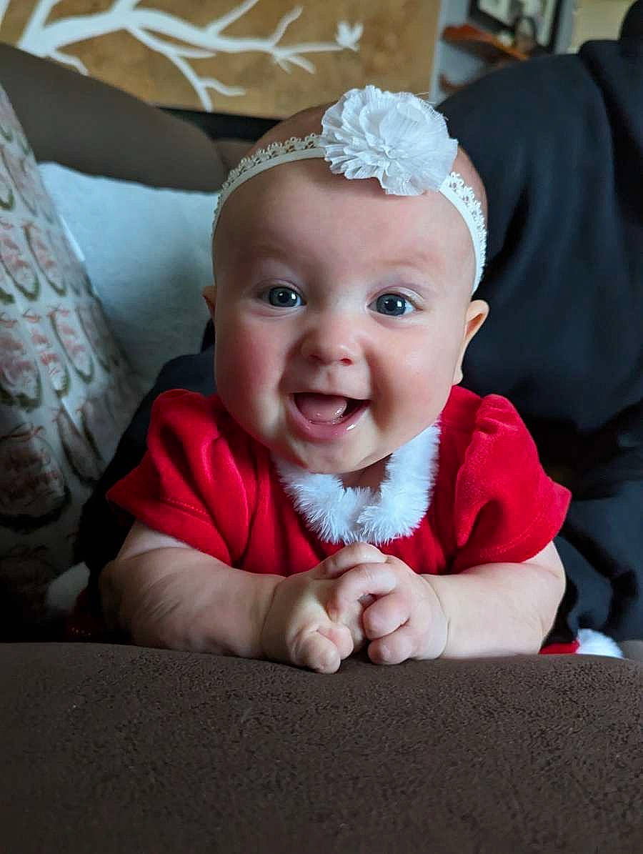 Olivia joined the competition — help win amazing prizes! baby, baby_toddler_clothing, child, comfort, event, facial_expression, fashion_accessory, flash_photography, fun, hair_accessory, happy, headband, headpiece, jewellery, magenta, person, pink, room, sitting, smile