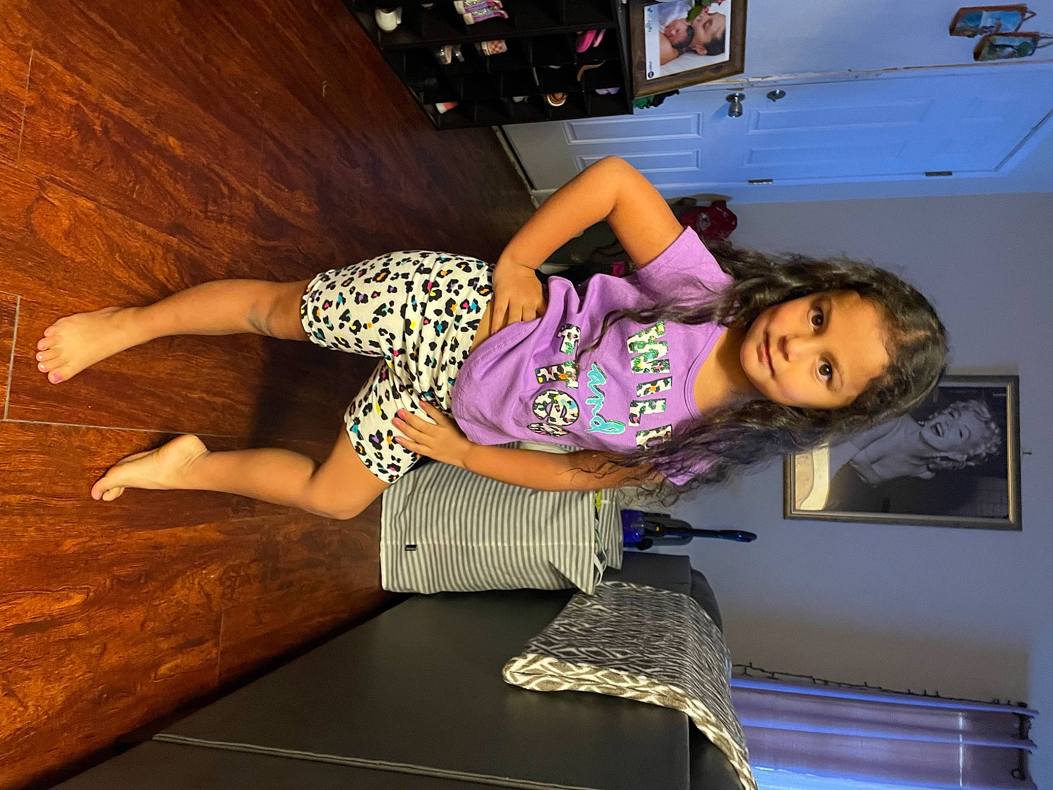 Khloe is registered to the contest to win money with this photo: comfort, elbow, fashion_design, flooring, fun, happy, hardwood, human_leg, joint, knee, leg, leisure, magenta, person, purple, room, smile, thigh, trunk, waist