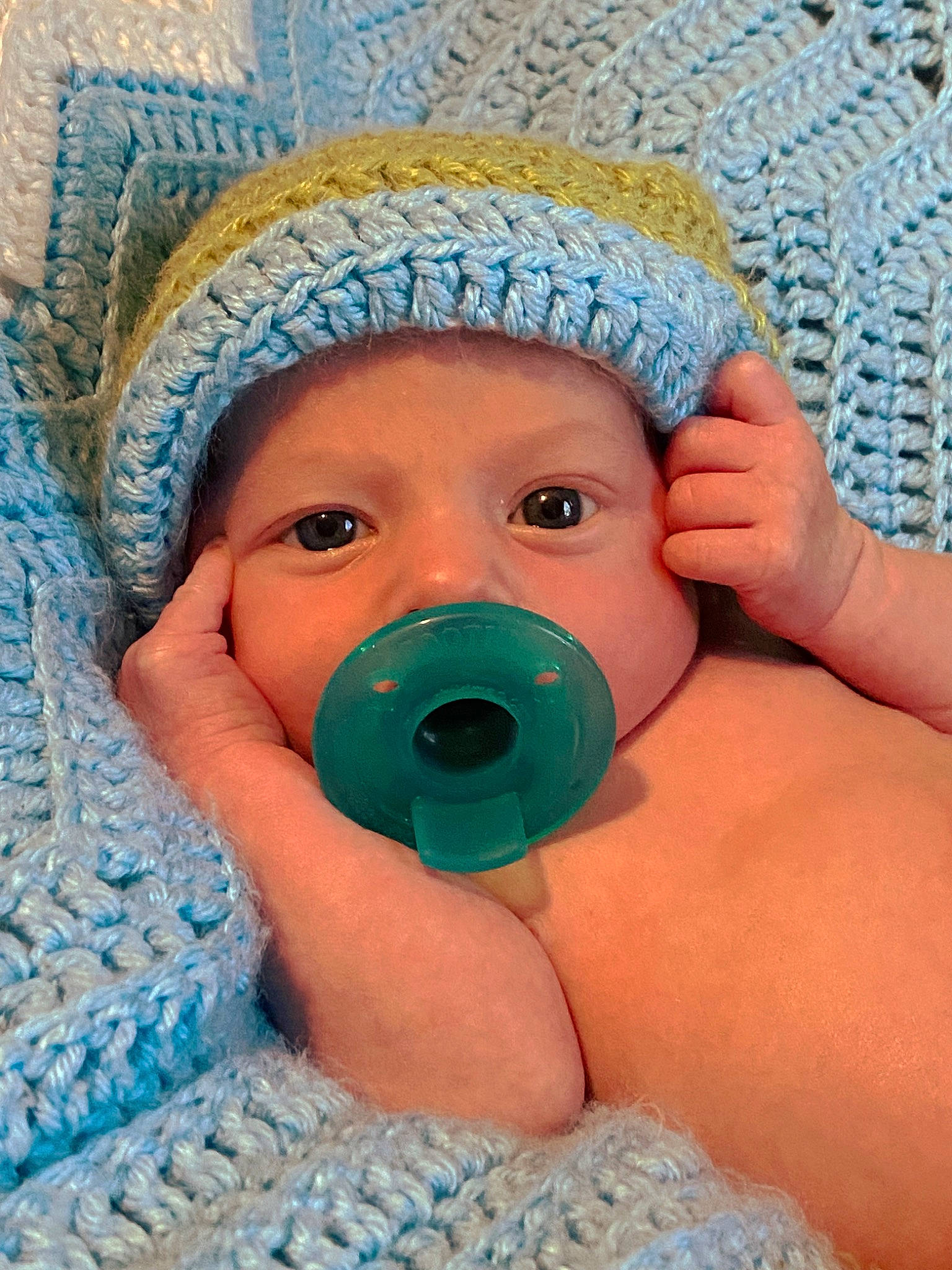 Kameron is registered to the contest to win money with this photo: azure, baby, baby_products, baby_toddler_clothing, blue, cap, cheek, child, close_up, eye, face, finger, hand, head, headwear, human_body, linens, nose, person, skin