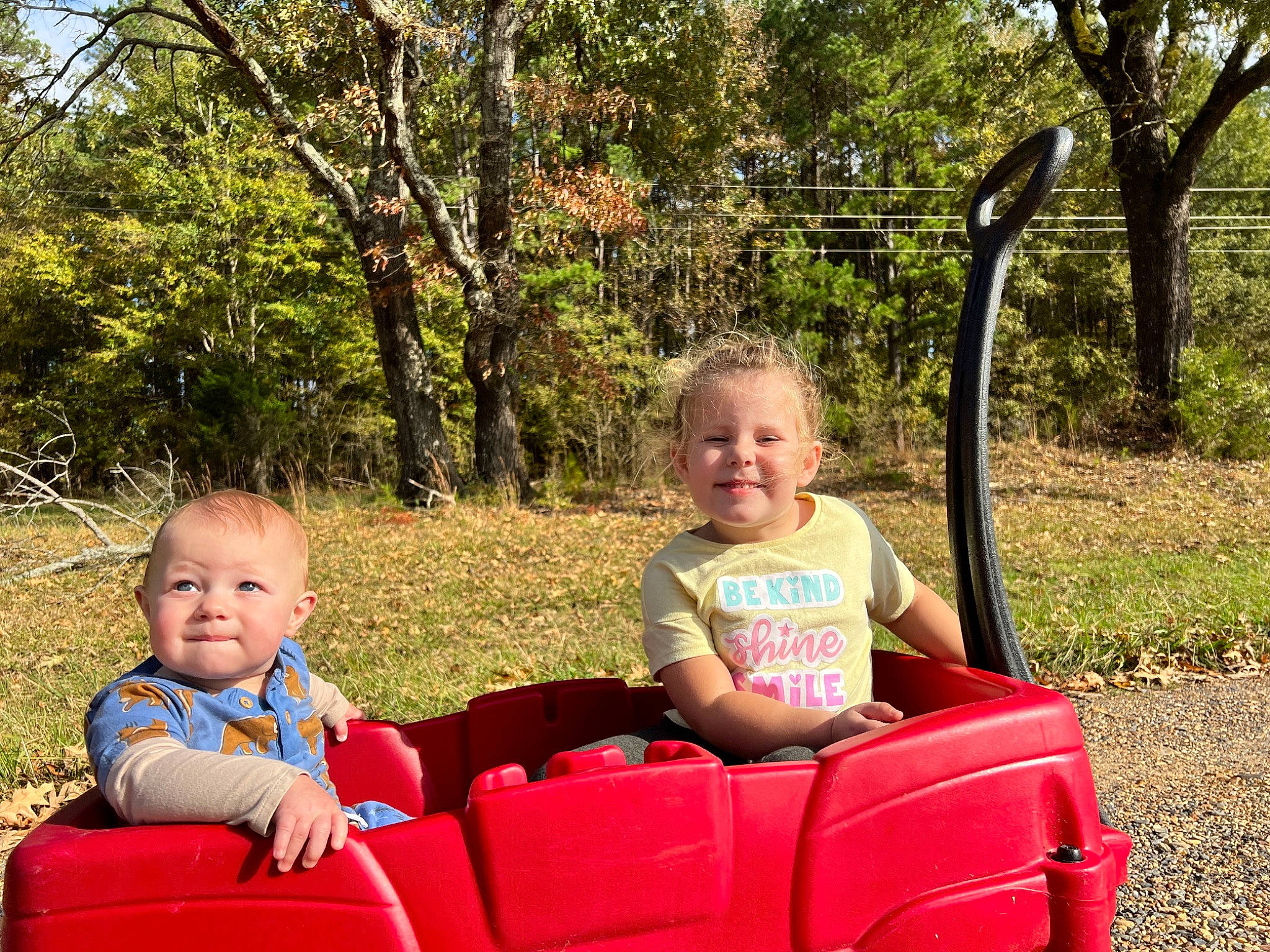 Madeline joined the competition — help win amazing prizes! baby_toddler_clothing, child, comfort, event, face, facial_expression, fun, grass, happy, joy, lap, leisure, motor_vehicle, people_in_nature, person, plant, recreation, smile, summer, toddler