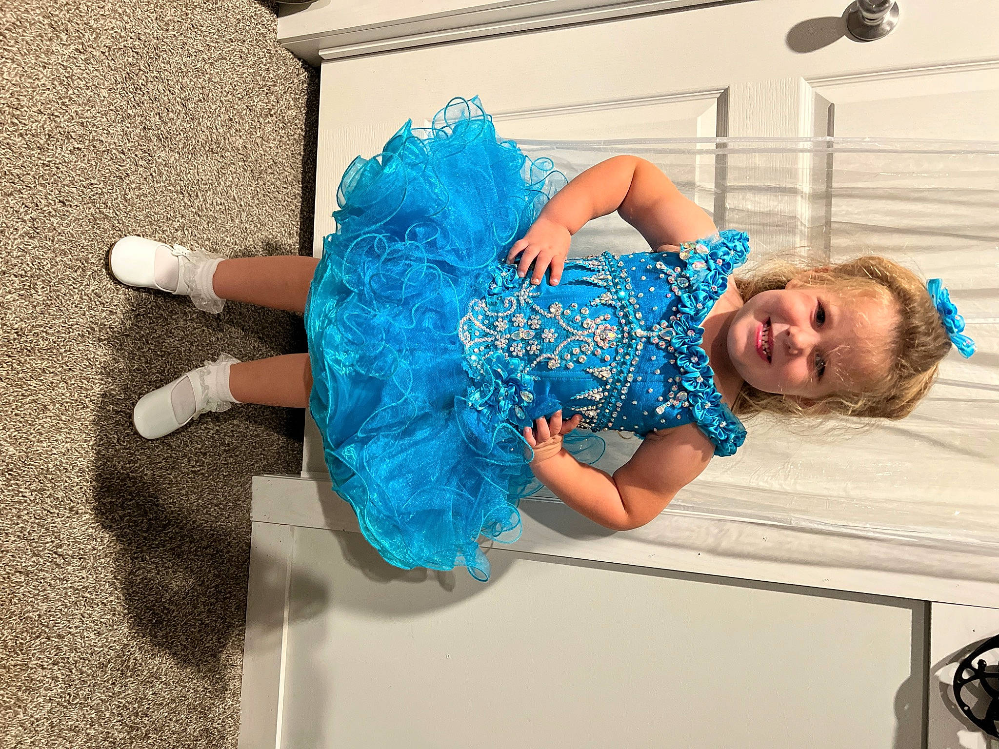 Madeline joined the competition — help win amazing prizes! azure, blue, child, denim, electric_blue, fashion_accessory, fashion_design, flooring, fun, happy, human_leg, joint, joy, leisure, pattern, person, sitting, t_shirt, thigh, toddler