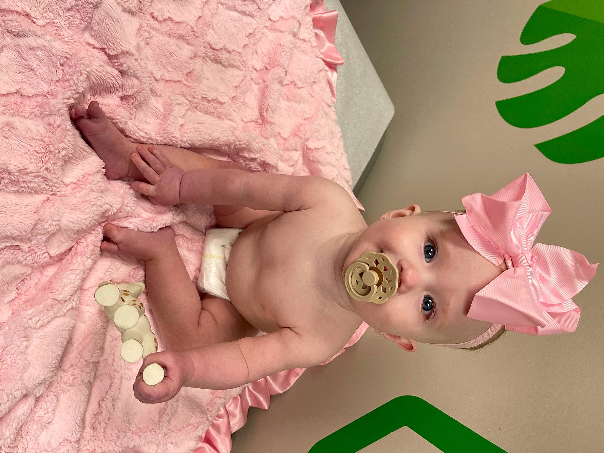 Wrenlee joined the competition — help win amazing prizes! abdomen, baby, baby_products, baby_toddler_clothing, cheek, chest, child, finger, foot, happy, headwear, human_body, human_leg, linens, magenta, person, pink, room, skin, thigh