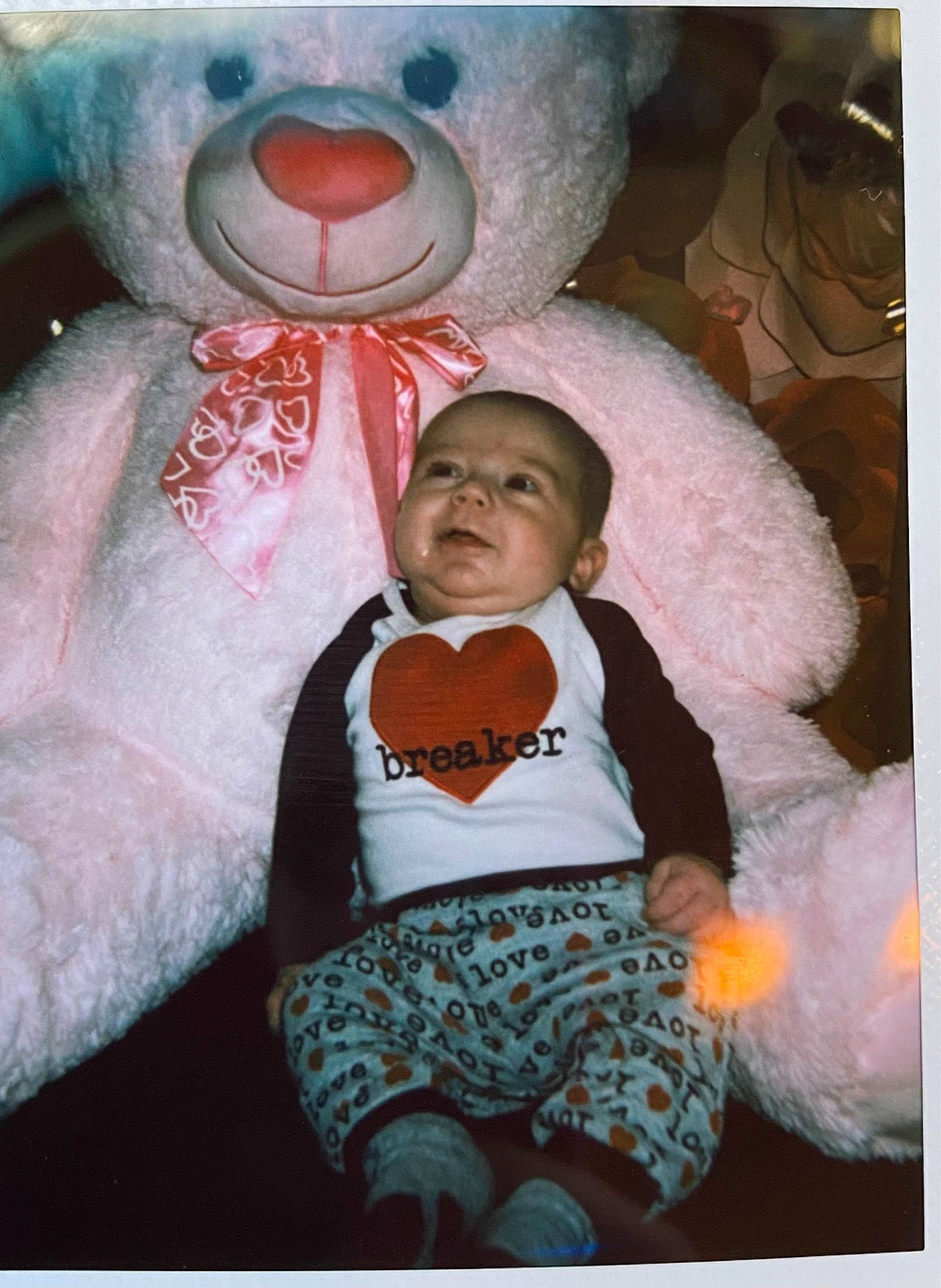 Ledger is registered to the contest to win money with this photo: baby, baby_toddler_clothing, cheek, child, comfort, fun, fur, happy, hat, mammal, mouth, nose, organ, person, photograph, pink, snapshot, stuffed_toy, textile, toddler