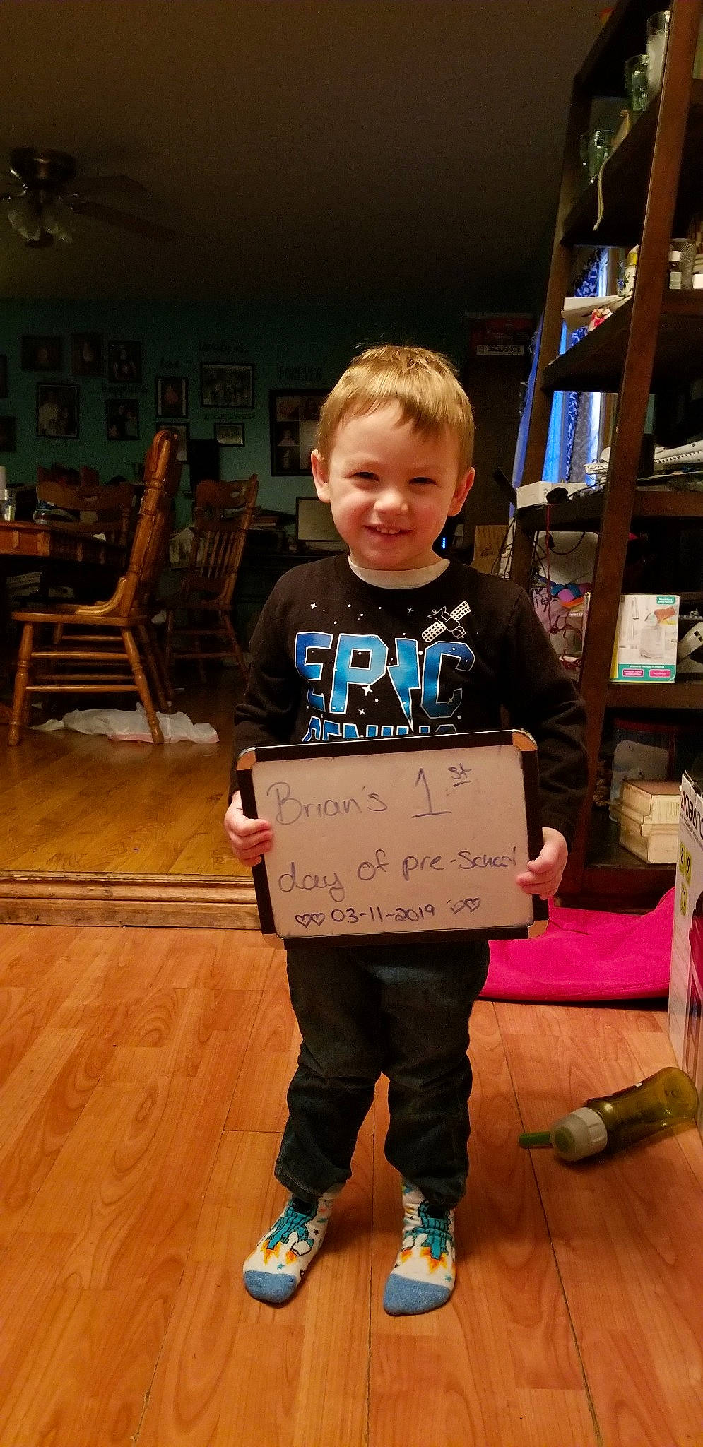 Brian is registered to the contest to win money with this photo: child, footwear, joy, person, smile, standing, t_shirt, toddler