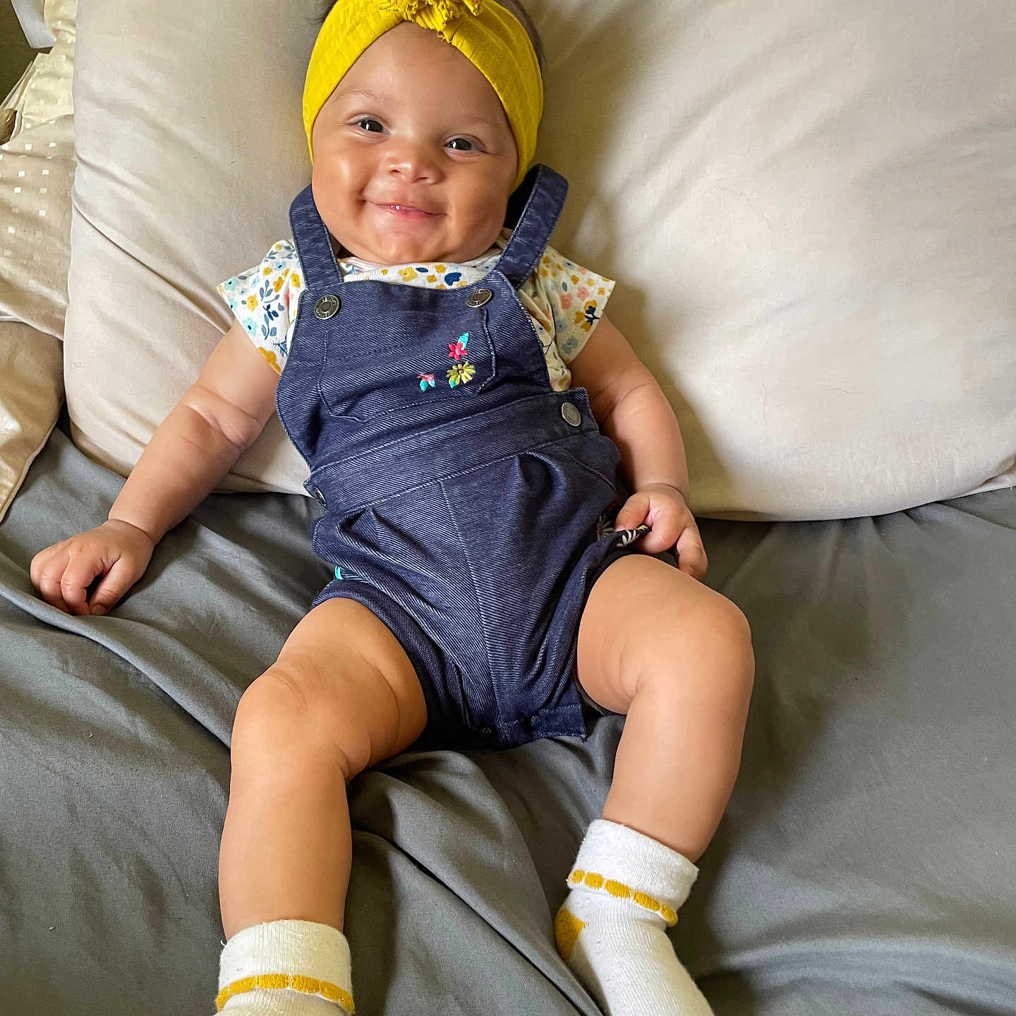 Natalie joined the competition — help win amazing prizes! baby, clothing, couch, cushion, face, footwear, furniture, happy, hat, head, homedecor, hosiery, pants, person, photography, portrait, shoe, sitting, smile, sock