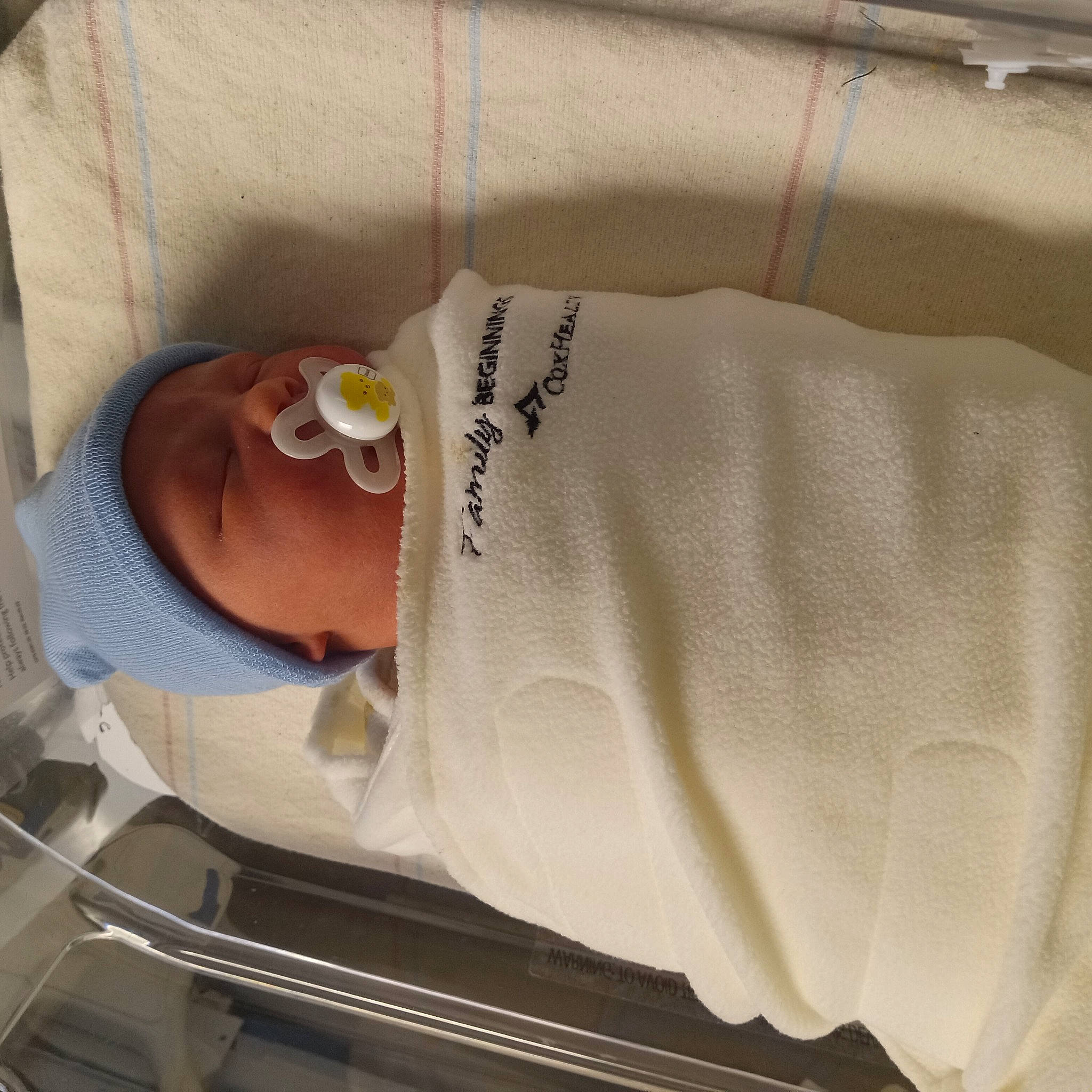 Timber is registered to the contest to win money with this photo: baby, baby_products, baby_safety, baby_toddler_clothing, child, comfort, hat, headgear, infant_bed, linens, person, room, sleeve, toddler