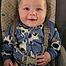 baby, baby_seat, babywear, blue_onesie, child, closeup, clothing, cow_pattern, cute, face, furniture, hand, happy, indoor, infant, portrait, seatbelt, sitting, smiling, young_child