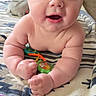 Zane joined the competition — help win amazing prizes! baby, blanket, blue_eyes, child, chubby, closeup, curious, cute, expression, face, hands, happy, indoors, infant, lying_down, playtime, skin, soft_toys, striped, toy